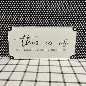 "this is us" Metal Sign in white with black trim