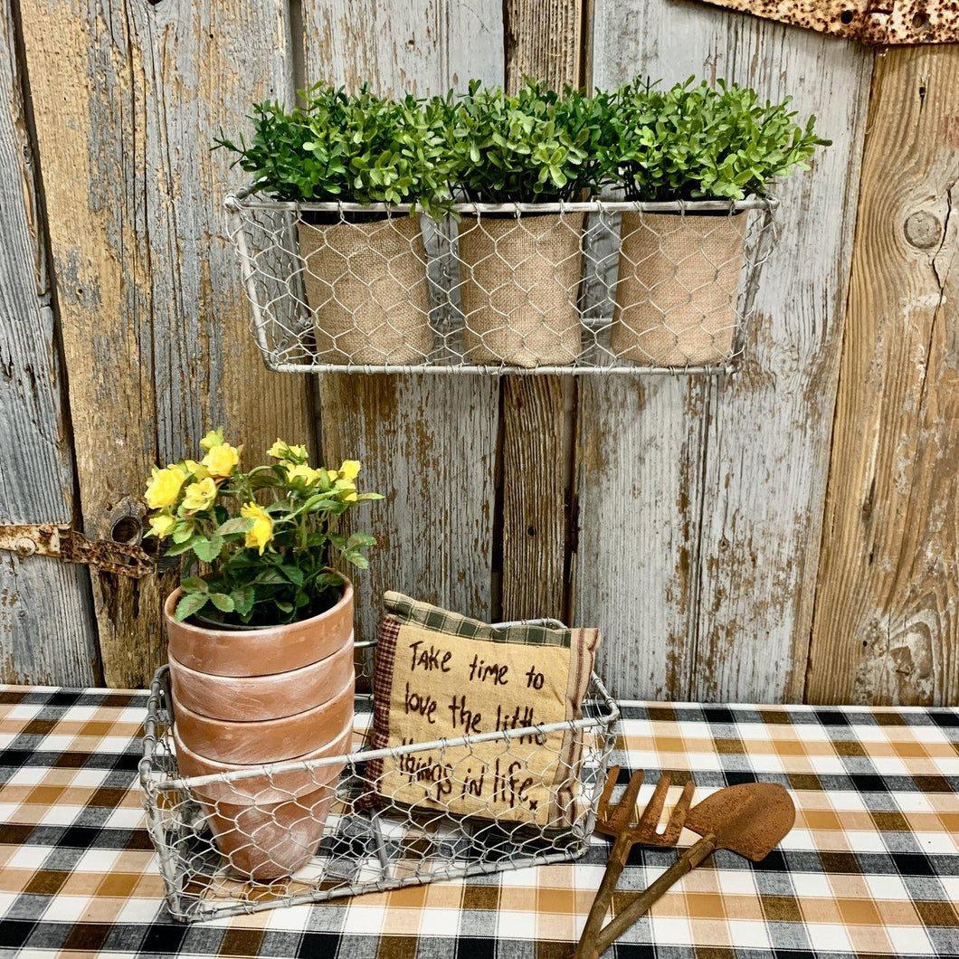 Set of wire wall baskets with plants